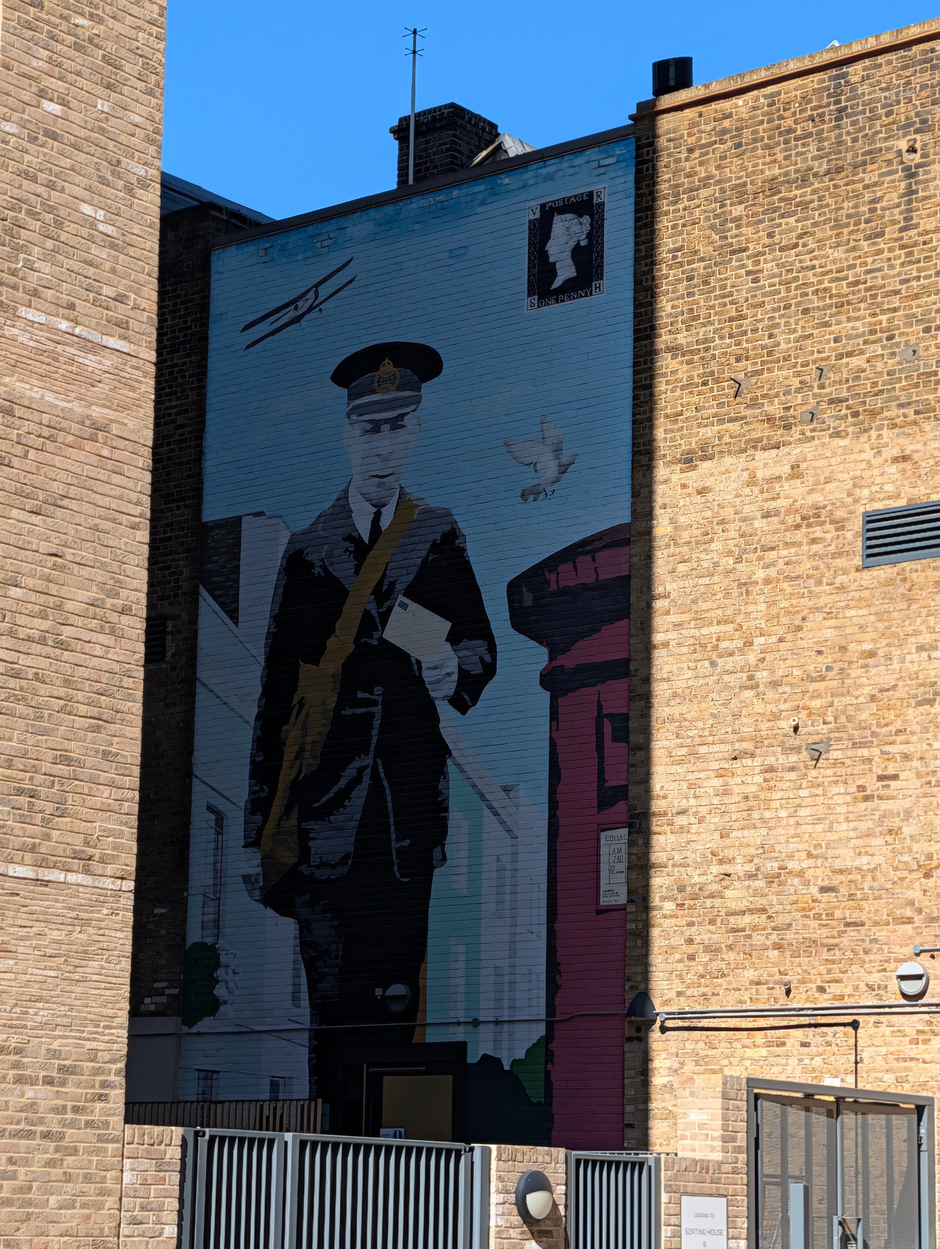 Postman, Biplane and Pigeon mural - The Postal Museum in London